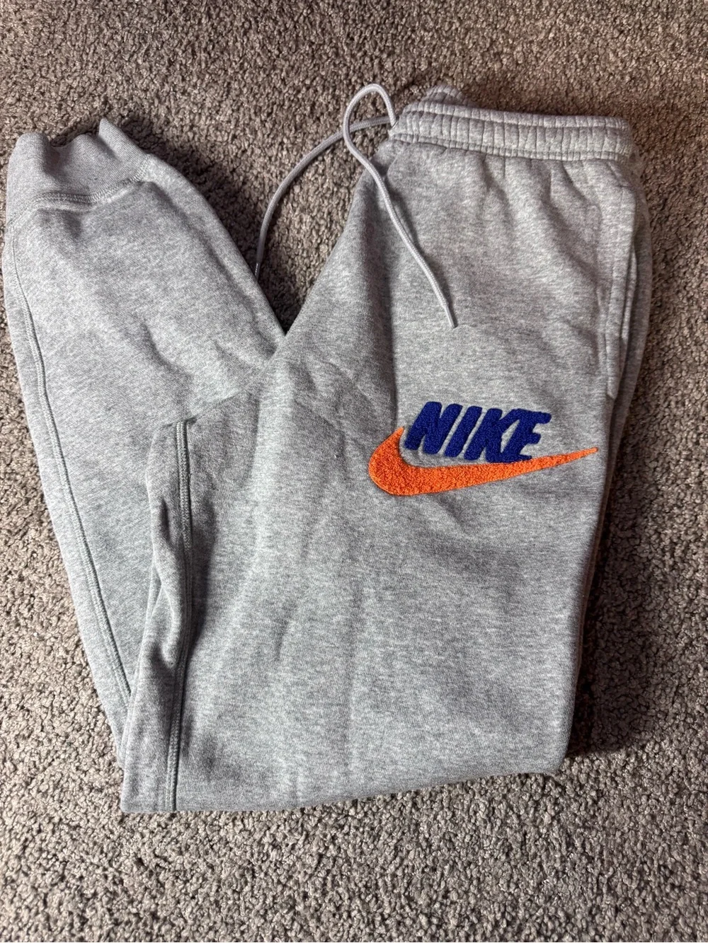 Nike Men’s Gray Sweatpants with Blue Logo and Orange Swoosh